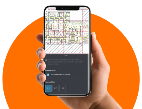 Hand holding a phone with mobile survey app loaded.